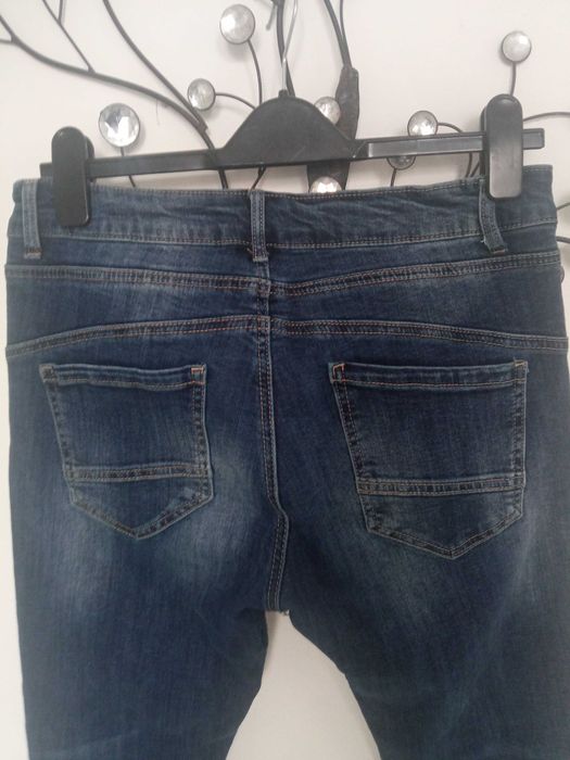 Melly & Co damskie spodnie jeans r L pas 80-90cm