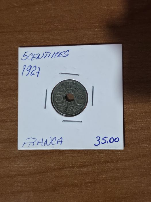 moeda francesa de 5 cêntimos datada de 1927,