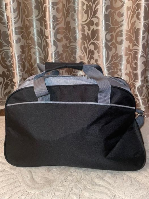 Дорожня вмістка сумка