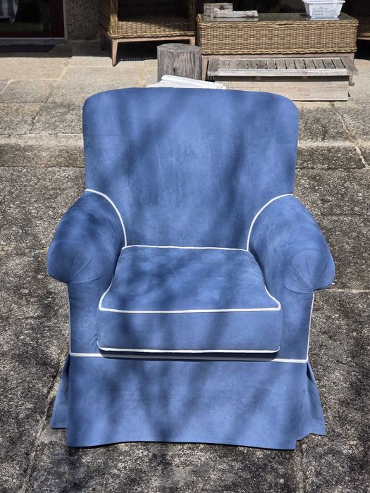 Blue upholstered armchair with white piping — excellent condition
