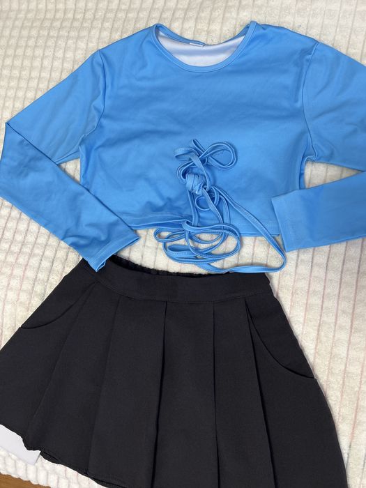 Спілниця та топ костюм