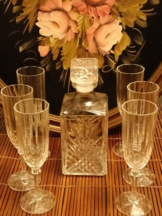 Vintage liqueur decanter and six tall glasses