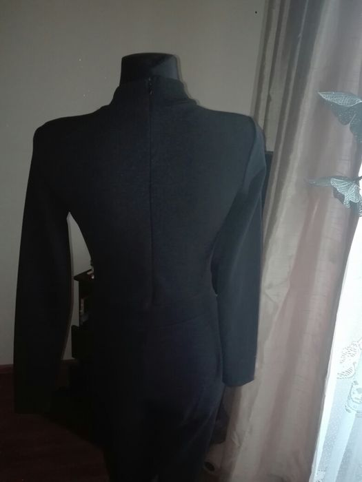 Nowy czarny kombinezon