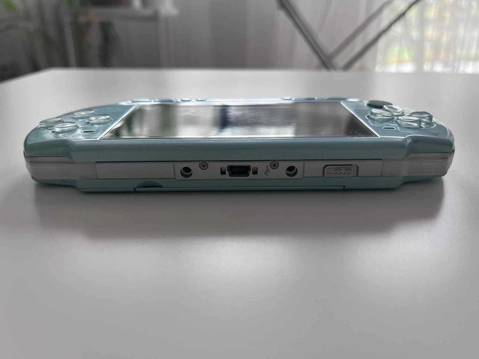 PSP 2000 Mint Green zielona, stan IDEALNY, org. ładowarka, adapter