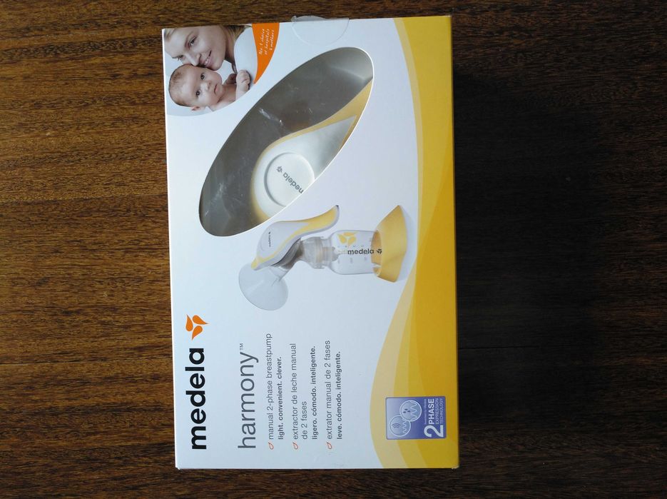 Bomba tira leite manual  e cx de 3 frascos da medela