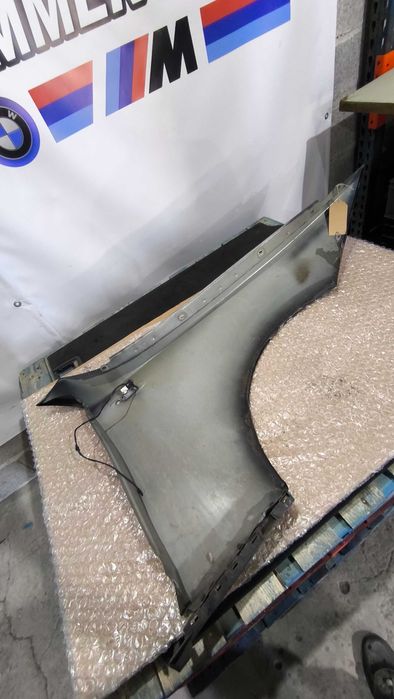 Guarda Lamas BMW (E81/E82/E87/E88) Esquerdo (Com defeito)