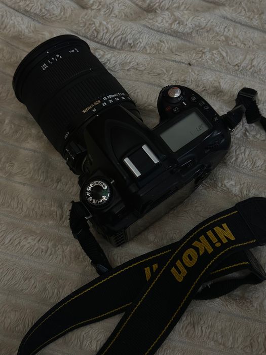 Nikon D90 + Sigma 18–200 + adapter do telefonu