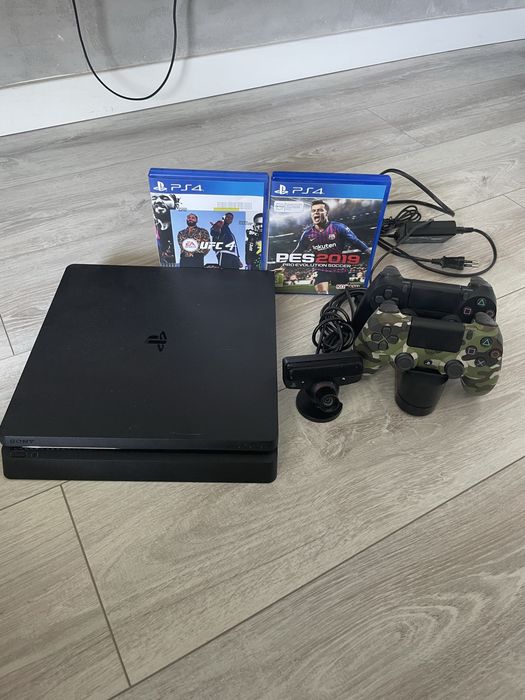 PlayStation 4 Slim 1TB + 2 pady + stacja ładująca + 2 gry + kamerka PS Eye