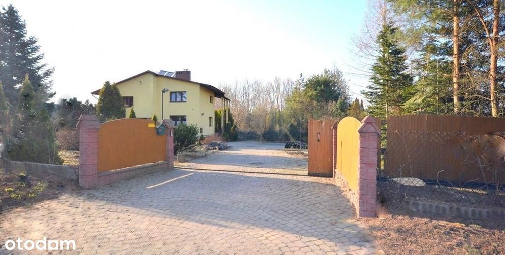 Dom w otoczeniu zieleni/grunt 13 ar./garaż.
