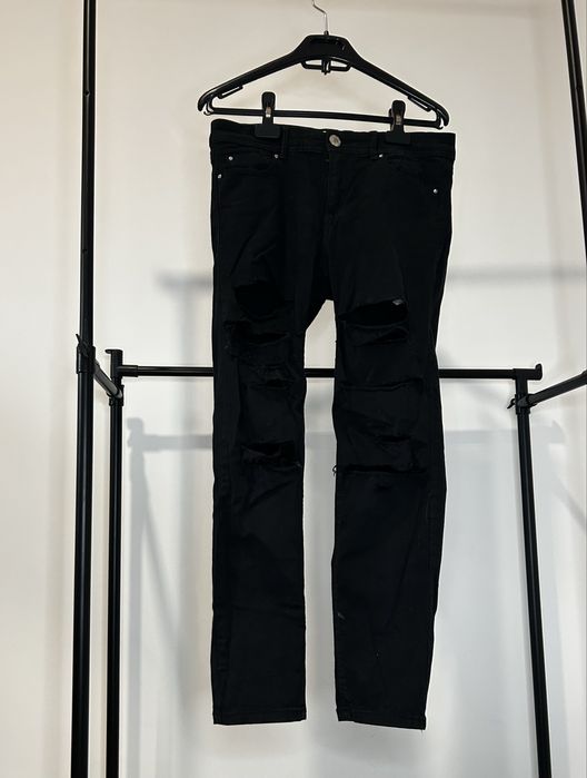 Calças de ganga rasgadas