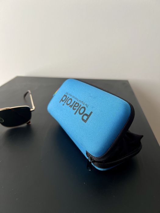 Oculos de sol dourados Polaroid