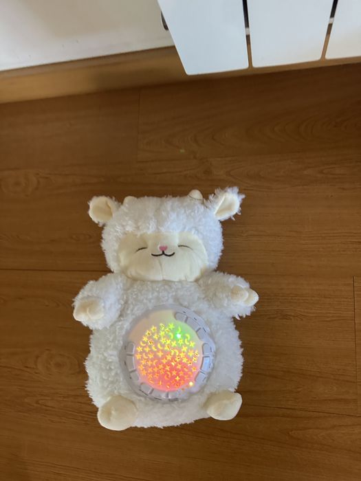 Peluche branco luminoso e com música