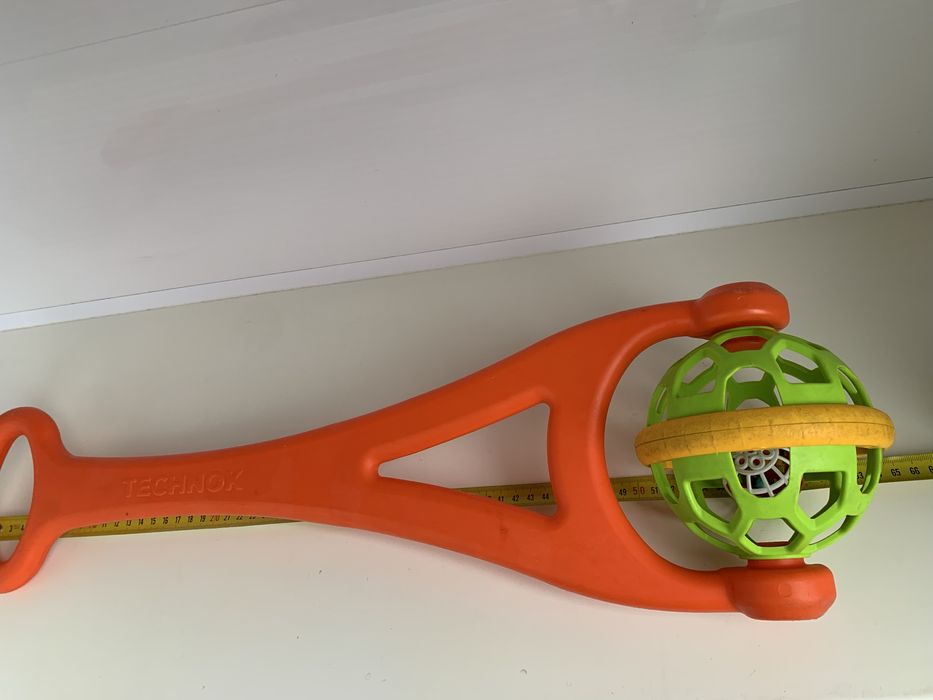 Іграшка каталка технок з брязкальцем