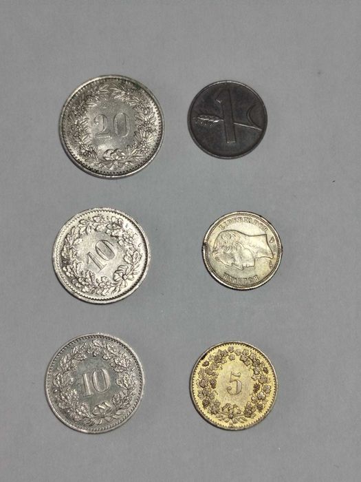 Lote de várias moedas antigas da Suiça