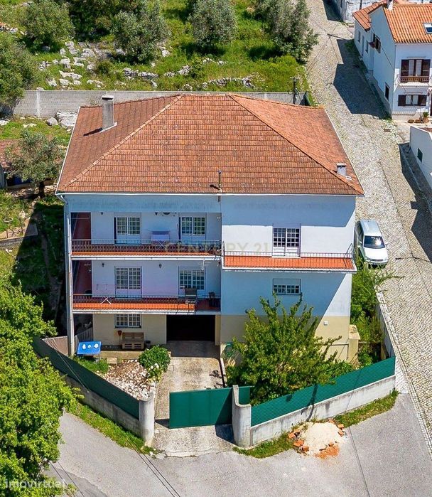 Prédio com 2 apartamentos+garagem+terreno