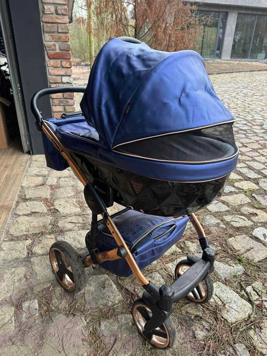 Wózek dziecięcy Junama dla dwójki dzieci w kolorze niebieskim