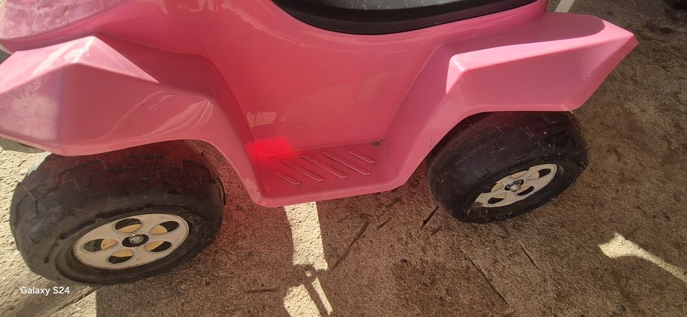 Moto rosa criança