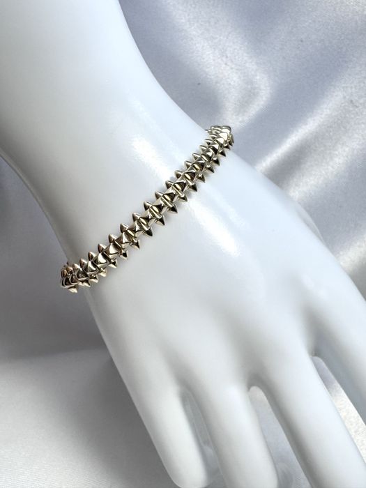 Золотий браслет у стилі Cartier