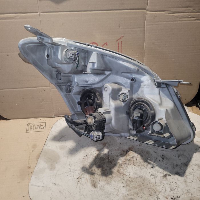 Lampa przód lewa Toyota Corolla Verso I E12 2003r oryginał