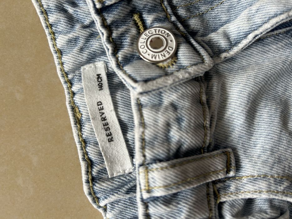 Jeansy Reserved z kokardkami rozm 140