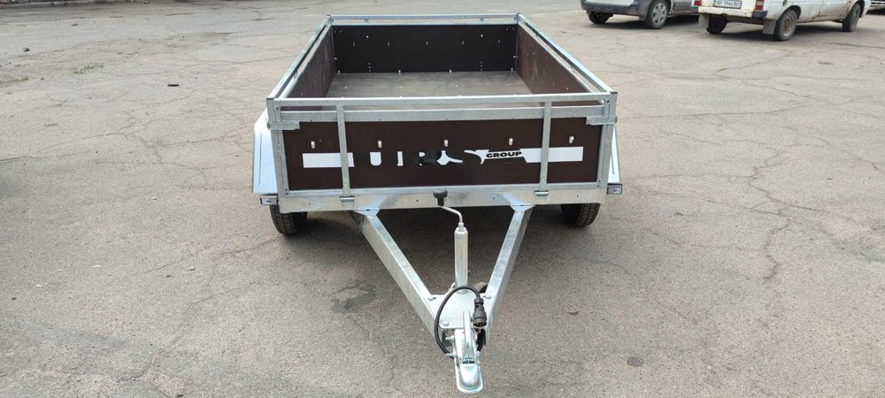 Прицеп двух осник, две оси, усиленный бортовой, оцинкованный Ursa,
