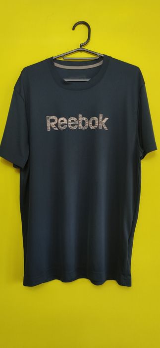 Koszulka sportowa firmy Reebok  z niezniszczalnym logo ;)  ZIP street