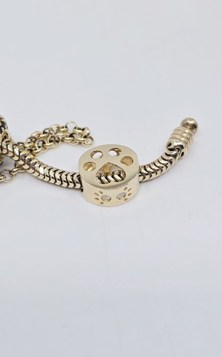 Złoty charms łapka próba