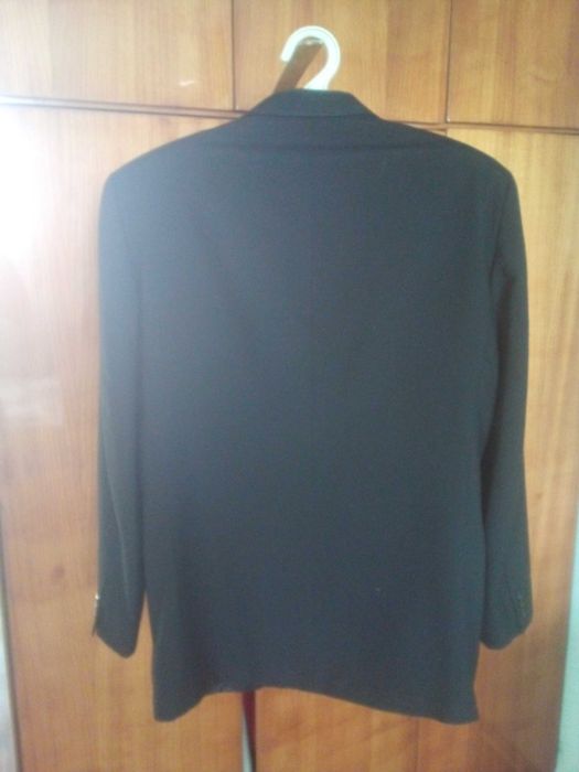 Костюм мужской,размер 52,100%шерсть,чёрного цвета.