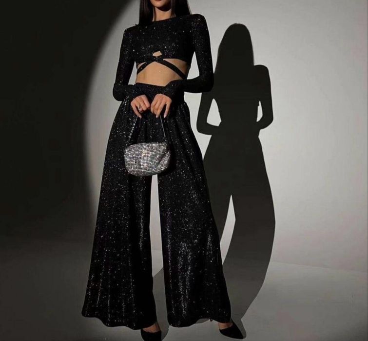 Жіночий блискучий костюм, топ і брюки