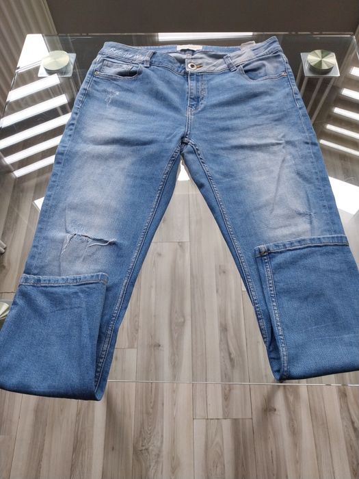 Jeansy damskie Reserved