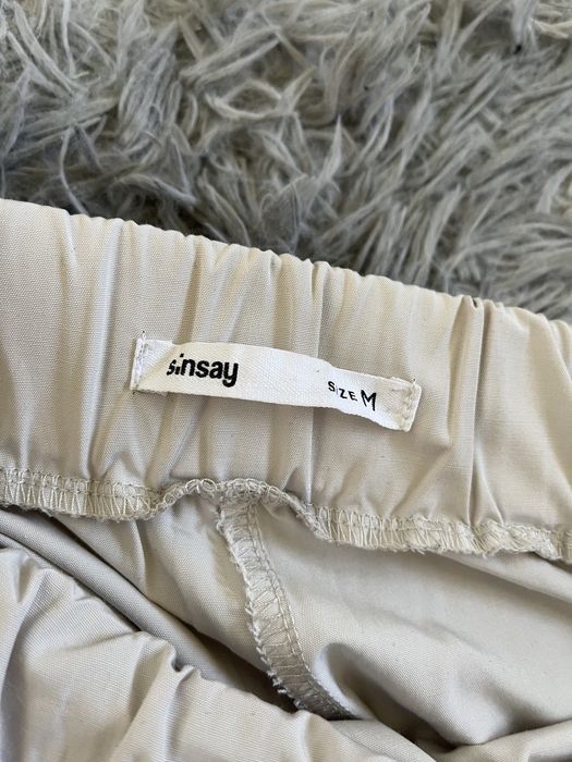 Spodnie damskie joggery z paskiem beżowe kremowe M Sinsay