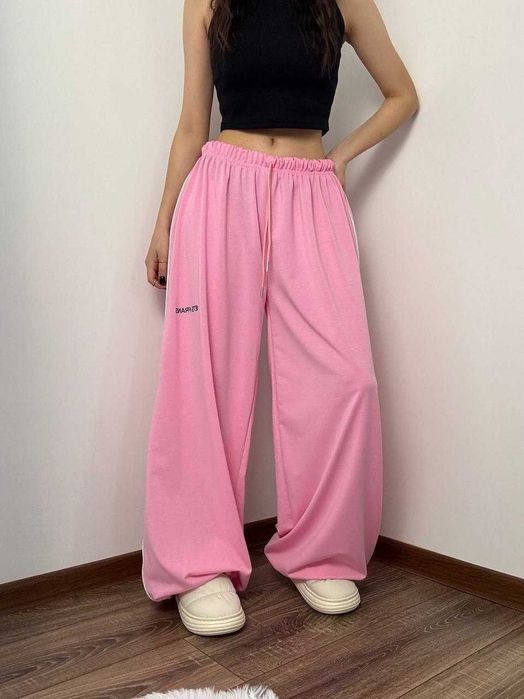 Жіночі весняні штани супер оверсайз широкі вільні с затяжками знизу