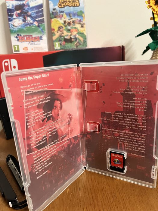 Nintendo Switch com Mario odyssey e Animal Crossing