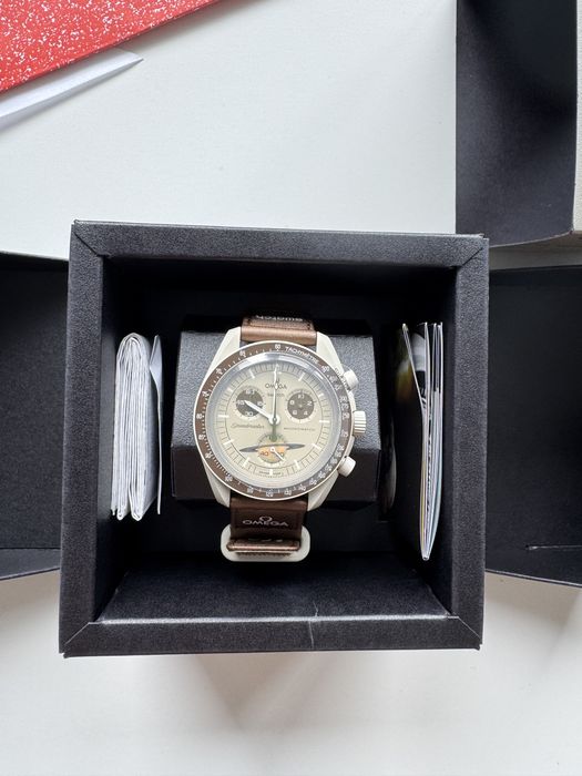 годинник Omega & Swatch