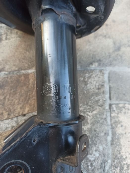 Стойка амортизатора мазда6