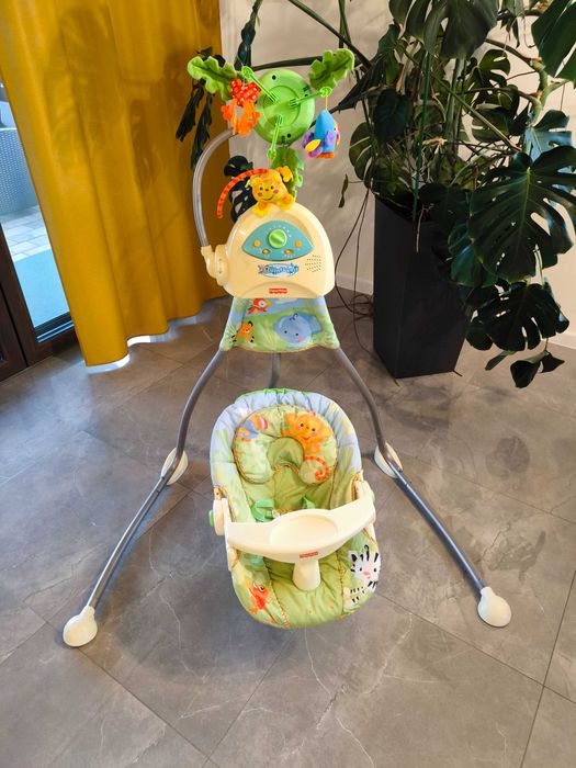 Huśtawka/bujak Fisher Price, gra, buja, kręcą się misie i liście.