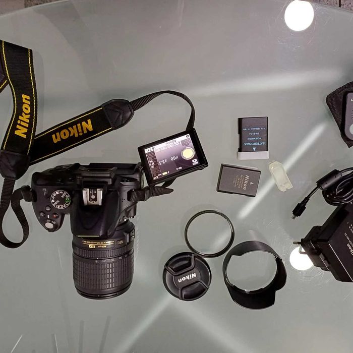 Nikon D5100 + 18-105 mm