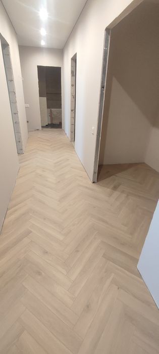 Укладка ламінату, паркетної дошки, вінілового покриття