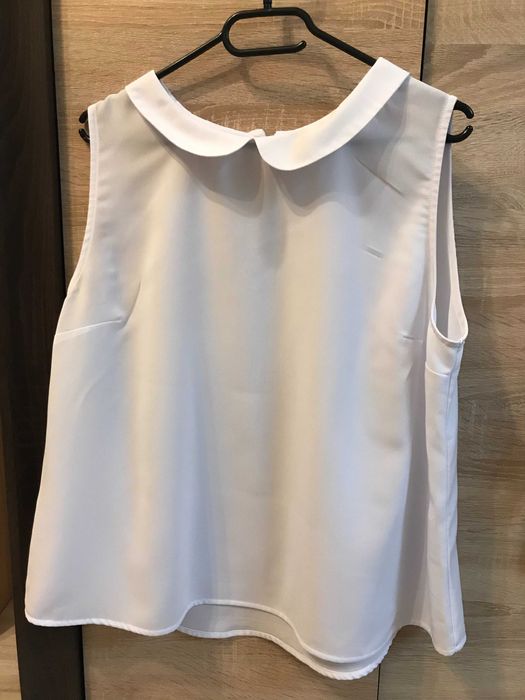 Biała koszula bez rękawów
