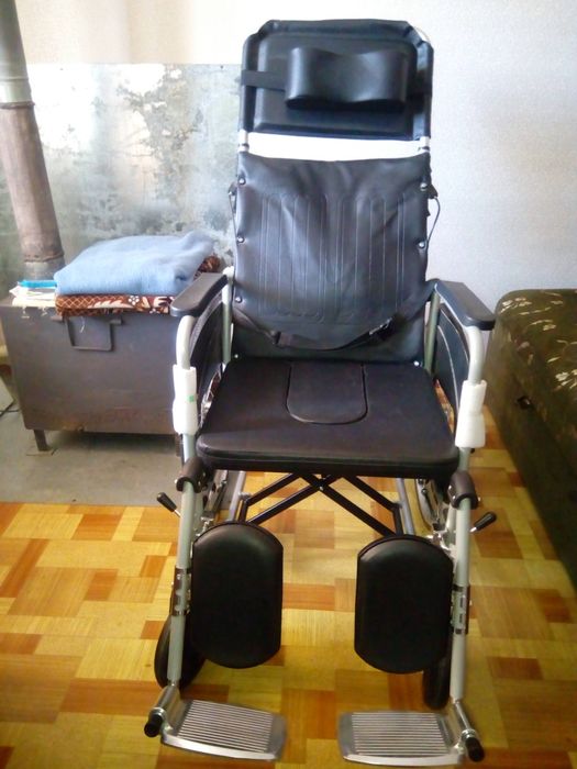 Инвалидная коляска .