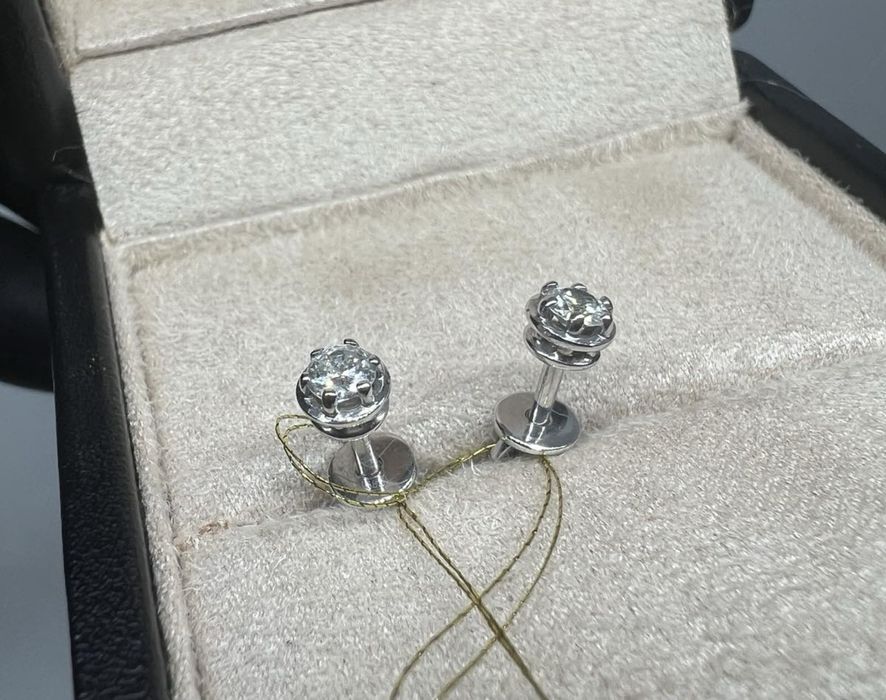 Золоті сережки на закрутках 0.27 карат. Бриллианты.
