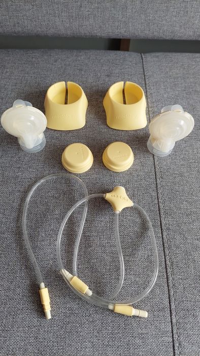 Laktator Medela Swing maxi podwójny na dwie piersi & calma