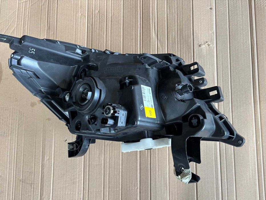 Farol / Ótica esquerda Nissan Navara NP300 / Frontier