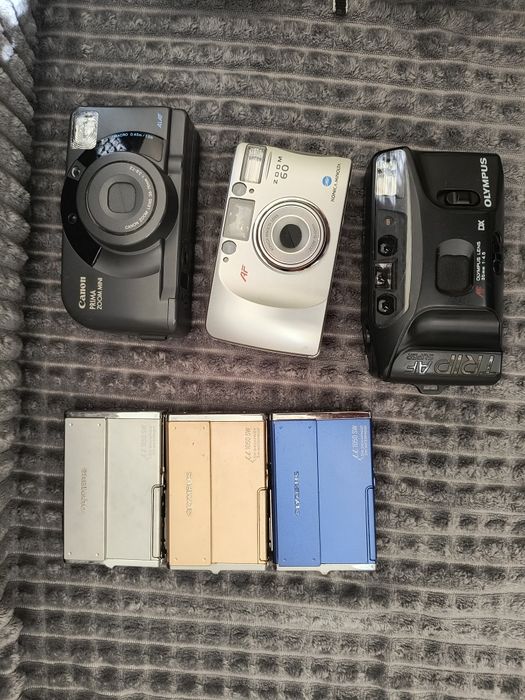 Olympus, Konica Minolta, Canon