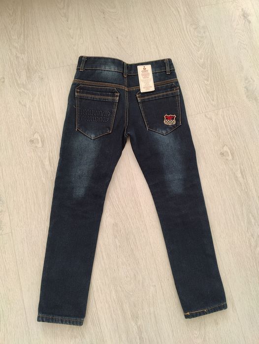 Продам нові зимові дитячі джинси 140/146