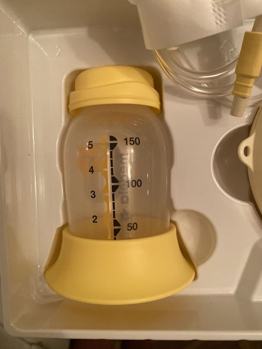 Електронный молокоотсос medela