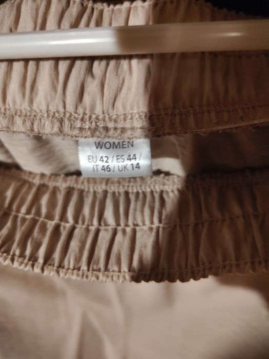 Beżowe letnie spodnie z szerokimi nogawkami 40/42 L/XL