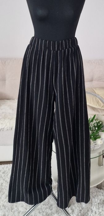Spodnie szerokie nogawki H&M".