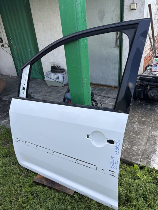 Двері водійскі кадді 2 .