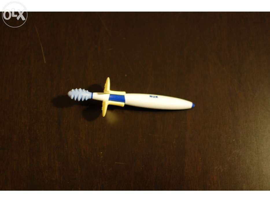 NUK Teether/Training Toothbrush with Protective Ring434463873927761921